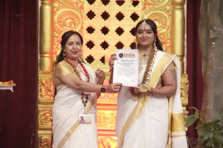 The Honored Komal Singh gives the certificate of recognition to the Mahant of Nithyananda Yogic Sciences, Mahayogini Ma Nithya Mahayogananda