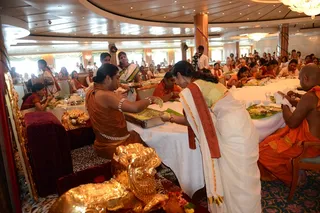 Sanyasis and ashramites receive blessed food directly from the Guru's hand, a part of Maheshwara pooja.