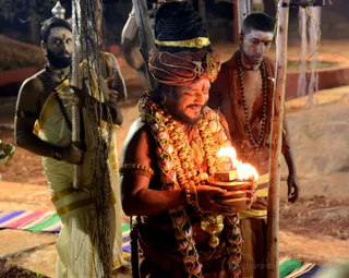 His Holiness travels to each of the Deities, lighting their lamps