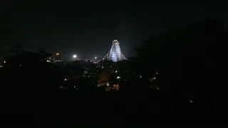 A long view of the Arunachala Temple Tower grandly lit for the festival