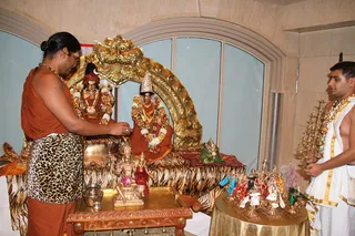 Swamiji doing abhishekam for deities