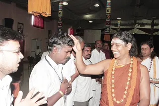 Devotees queue up for blessings.