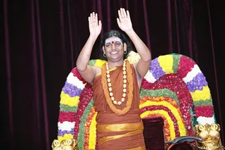 Swamiji blessing all eagerly waiting devotees - in the hall and online.