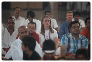 Devotees Listening To Satsang