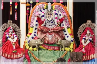 Devi along with Lakshmi and Saraswathi
