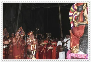 Deepam at the shrine of Lord Dakshinamurti, the primeval Guru, under the banyan tree