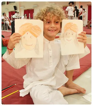 En-Genius Child Drawing and Showing Swamijis murthy.