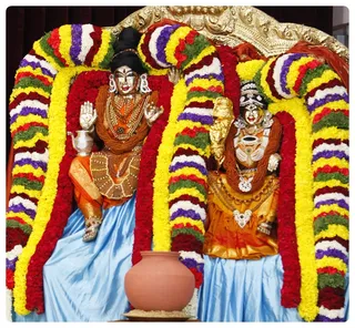 Meenakshi and Sundereswara in Thaneer Pandal Aruliya Leelai.
