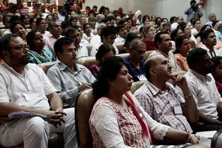 Delegates listen intently.