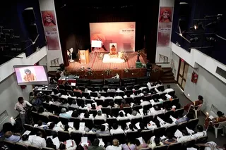 Delegates meditate.