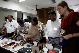 Devotees persue the Galleria stall.