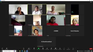 A Zoom meeting screenshot showing a gallery grid of video participants, mostly women and one man, with names labelled under each tile. Top left, a woman with glasses presses her palms together in anjali. Top centre, a smiling woman in a white top sits before a wall picture, labelled Premabhaktika. Other tiles show a woman in purple, a man in a red shirt labelled Purusoth, and a woman in a red-and-white sari. Several tiles are plain dark panels with names or numbers. The Zoom toolbar shows Mute, Start Video, Share Screen, Chat and End buttons, with the clock reading 10:42 AM on 2024-05-10.