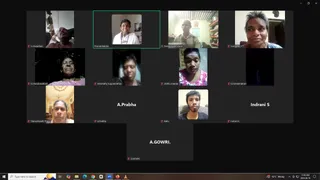 A screenshot of a video conference call in a Zoom-style grid showing about ten participant tiles on a dark background. Most tiles show individuals in homes or indoor rooms, some with cameras partly off or showing only a name label. One tile shows a woman in white clothing with a red bindi and beads, another shows a man in a khaki shirt in a room with shelves and a framed picture. Other tiles show women and men in everyday clothes, one in pink. Name labels read Premabhaktika, Paramasivam Karur, S.Viswanthan, S.Amutha, K.Chandravathani, Wanmathy Sugunanathan, Mithu Mannar, K.Kamalanathan, Thanushkanth Thanu, A.Prabha, Rahu, Indrani S and A.GOWRI. A Windows taskbar and clock showing 11:28 AM 2024-08-19 appear along the bottom. No a person candidate is visible.
