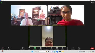 A Zoom video call screenshot showing three participants in separate tiles. Top left, a woman with short light hair and glasses sits with palms pressed together in namaste, wearing a white top, in a room with a framed deity painting and a wooden shelf holding a seated figure in orange and saffron robes. Top right, a smiling woman in glasses, a red shawl and a small red bindi sits before a dark wooden shrine. Bottom centre, a smiling woman with a red bindi is framed in a portrait tile. The Zoom toolbar with Participants, Share Screen, Chat and Leave buttons is visible along the bottom, and the taskbar shows the time 7:05 AM on 6/17/2024.