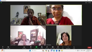 A Zoom meeting screenshot showing four video tiles of women participating from home settings. Top-left, a woman with a bindi in a rust-orange shawl presses her palms together in namaste beside framed pictures, including a portrait of a figure with a halo-like hairstyle. Top-right, a woman in red wearing glasses, a red bindi and a beaded necklace speaks to the camera, labelled C A Shakunthaladevi Dayalingam. Bottom-left, a woman with glasses in a white top and dark shawl presses her palms together before a wooden shelf with a deity picture and a statue of a saint with a staff, labelled martha watson. Bottom-right, a woman with short dark hair in a brown top, labelled Abha Sharma, looks toward the camera. The Zoom control bar shows Mute, Stop Video, Participants 4, Share Screen and Leave, with the time 7:05 AM and date 2/24/2024 in the taskbar.