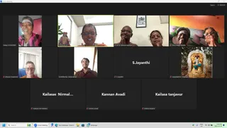 A screenshot of a Zoom meeting grid with a dark interface and a taskbar showing the time 8:00 PM on 2024-10-10. Participant tiles show several people smiling or greeting with palms together, including a woman in a pink top with a forehead mark, a woman in a red blouse at the center, a man and woman with hands joined near a framed picture, and a man and woman in front of a colourful floral backdrop. Other tiles show a woman in a blue-and-white setting, a man in a dark shirt, a bare-background tile labelled S.Jayanthi, and a tile showing a golden deity murti in a white arched shrine. Several tiles are plain name-only placeholders. No a person candidate is clearly visible.