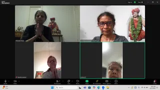 A Zoom video call screenshot showing four participants in a grid. Top left, Nirmala Sivaji, a woman in a black top with hands pressed in anjali, with a small figure of a saffron-robed sannyasi with red turban on a shelf behind her. Top right, Ca Shakunthaladevi Dayalingam, a woman in dark glasses and a red bindi, beside a framed picture of a saffron-robed figure with a red turban and green garland. Bottom left, Martha Watson, a woman with glasses and hands pressed together in namaste, beside a small framed deity picture. Bottom right, Indrani S, a woman with glasses and a red bindi. The Zoom interface controls are visible along the bottom, and the taskbar shows 6:04 AM on 9/17/2024.