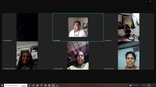A screenshot of a Zoom video call grid showing six participant tiles. Top centre, a woman in white clothes with a beaded necklace smiles in a framed tile labelled Premabhaktika. Top right, a shirtless older man wearing a rudraksha-style bead necklace sits in front of a framed gold deity picture; his tile is labelled S.Viswanthan. Bottom left, a smiling woman with long dark hair in a patterned top is labelled Arunthathy Karunakaran. Bottom centre, an older woman in glasses and a yellow-green top is labelled K.Chandravathani. Bottom right, a woman with hair tied back and a light top is labelled Thiripurasundary. Top left, a dark tile labelled K.Kamalanathan shows no clear figure. The Zoom interface shows the time 12:00 PM and date 2024-08-28 in the taskbar.