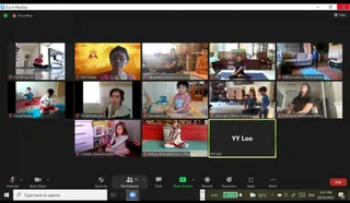 A Zoom video call screenshot in a 4-by-4 grid showing a person Yoga online eGurukul class. Participants sit or stand in home rooms on yoga mats, some cross-legged, one standing in a patterned top. One tile shows a golden illustrated image of Ma Durga with a golden-orange background. A Zoom toolbar at the bottom lists 13 participants, with the recording indicator and a 3:41 PM timestamp dated 24/10/2021 visible in the taskbar. Physical participants are ordinary home-clad people; no a person candidate is visible.